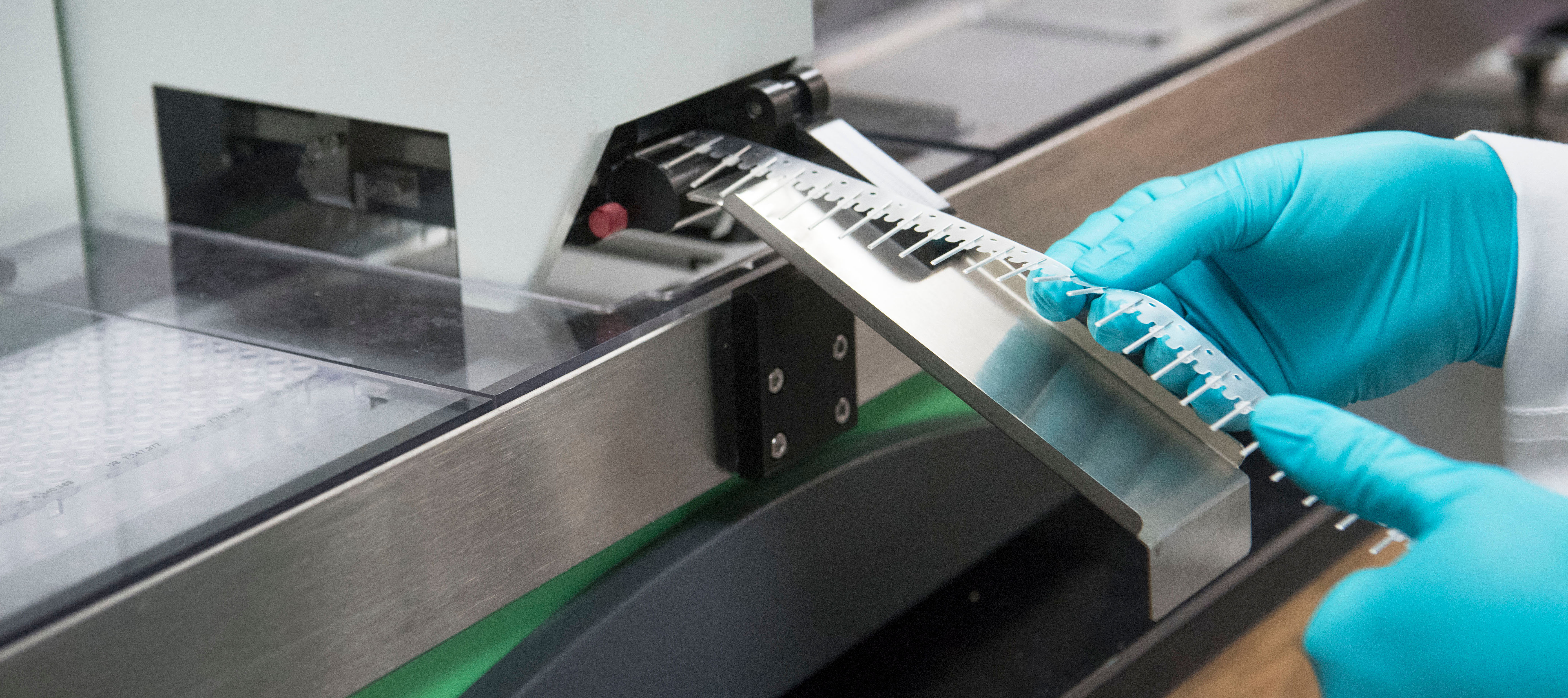 Lab employee working with lab equipment